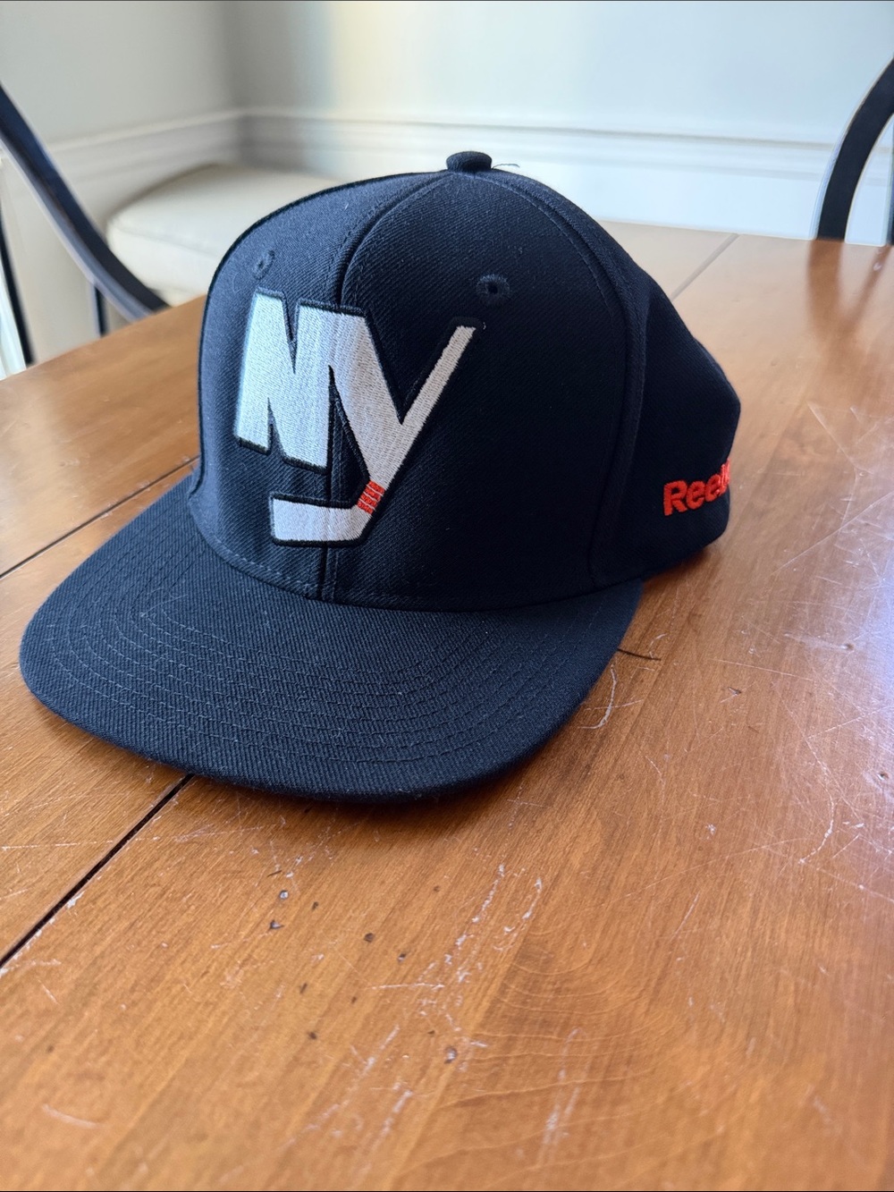 Reebok Black NY Islanders Snap Back Logo Trucker Hat  with orange Accent